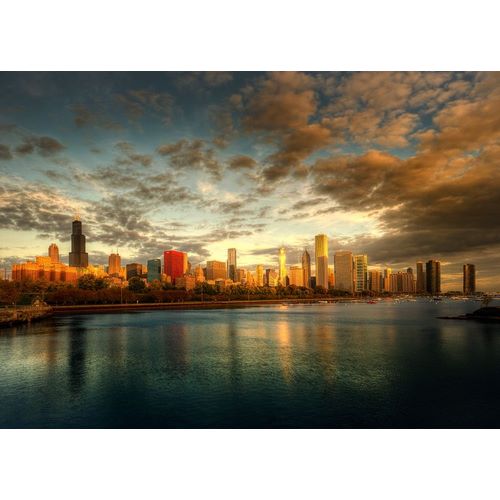 Chicago skyline over lake Michigan as sunrise enters a new day